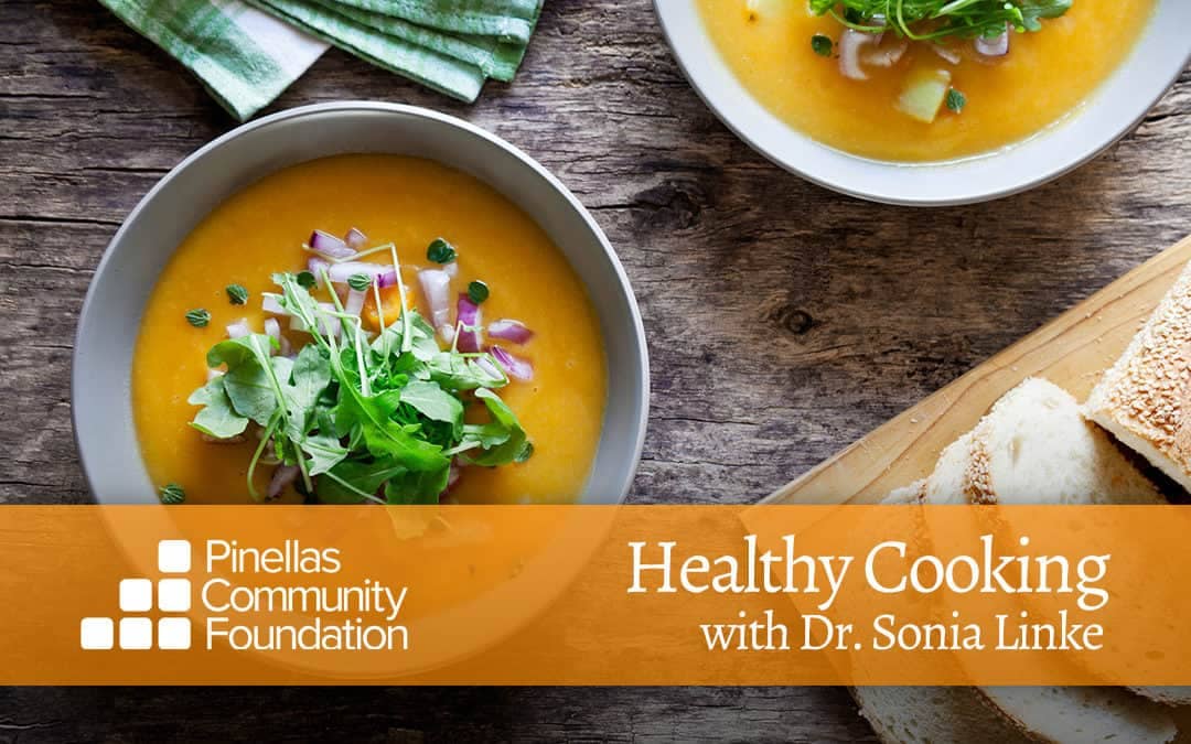 Yellow squash soup topped with baby greens and diced red onions to warm up the winter.