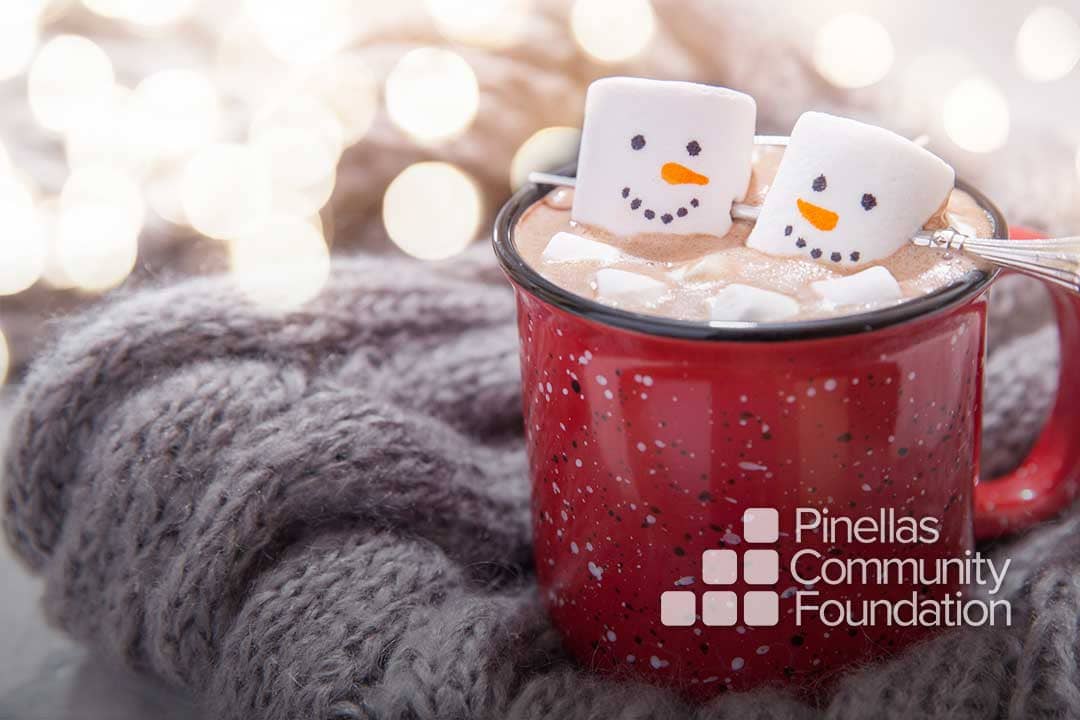 Two marshmallows avoid lonely holidays together in a cup of cocoa.