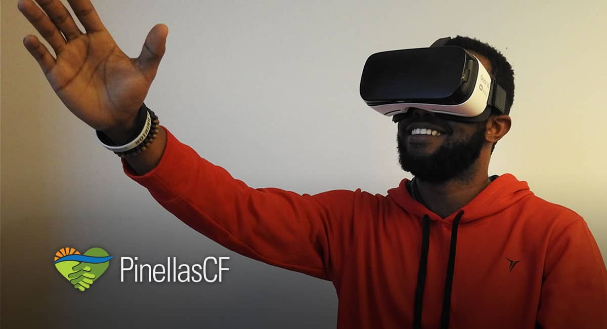 Young man uses Virtual Reality headset