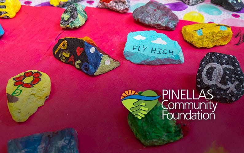 Colorful rocks painted by Girls Inc. participants.
