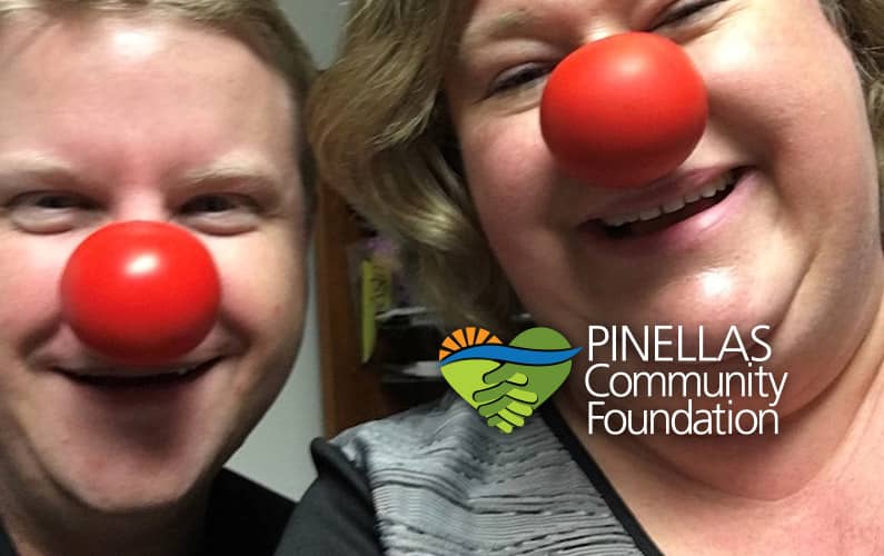 Duggan and Suzanne wearing red clown noses to raise funds.